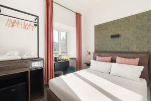 En eller flere senge i et værelse på R.C. Vatican View