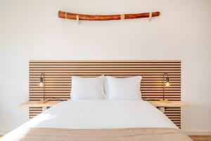 Giường trong phòng chung tại GuestReady - Urban adventure in Costa da Caparica +19 ảnh