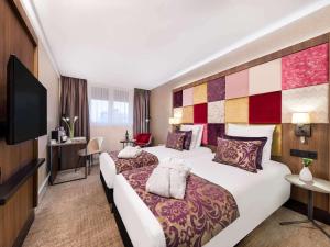 Postel nebo postele na pokoji v ubytování Mercure Budapest Korona