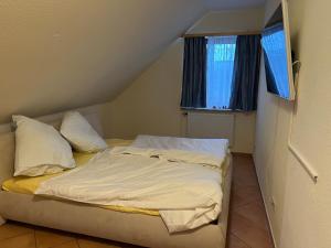 Postel nebo postele na pokoji v ubytování HS Hotel