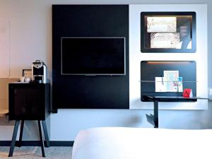 Postel nebo postele na pokoji v ubytování ibis Styles Genève Carouge