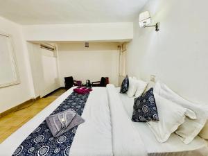 Letto o letti in una camera di Silver Land with mountain view - A River side property