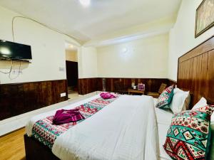 Letto o letti in una camera di Silver Land with mountain view - A River side property
