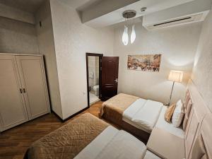 Postel nebo postele na pokoji v ubytování Safran Hotel