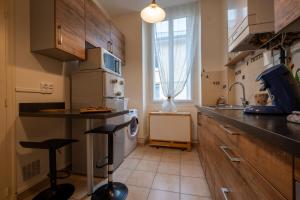Η κουζίνα ή μικρή κουζίνα στο Le Downtown, emplacement idéal à Auxerre +4 φωτογραφίες