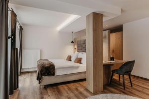 Postel nebo postele na pokoji v ubytování Freina Mountain Lifestyle Hotel