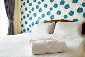 Postel nebo postele na pokoji v ubytování Alisa Krabi Hotel-SHA Plus