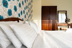Postel nebo postele na pokoji v ubytování Alisa Krabi Hotel-SHA Plus