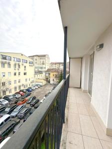 a balcony with cars parked in a parking lot at Old City Views - Luxury 2BDR Apt & Free Parking in Sofia