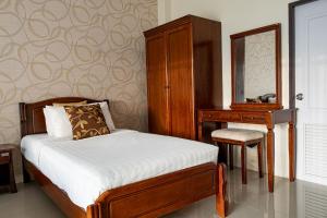 Postel nebo postele na pokoji v ubytování Alisa Krabi Hotel-SHA Plus