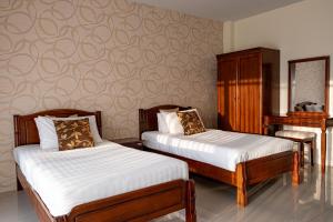 Postel nebo postele na pokoji v ubytování Alisa Krabi Hotel-SHA Plus