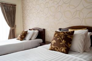 Postel nebo postele na pokoji v ubytování Alisa Krabi Hotel-SHA Plus