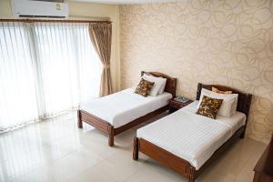 Postel nebo postele na pokoji v ubytování Alisa Krabi Hotel-SHA Plus