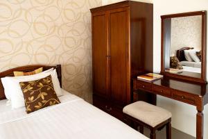 Postel nebo postele na pokoji v ubytování Alisa Krabi Hotel-SHA Plus
