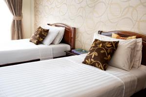 Postel nebo postele na pokoji v ubytování Alisa Krabi Hotel-SHA Plus