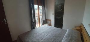 Postel nebo postele na pokoji v ubytování Hotel Eleonora