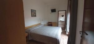 Postel nebo postele na pokoji v ubytování Hotel Eleonora