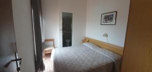 Postel nebo postele na pokoji v ubytování Hotel Eleonora