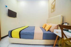Postel nebo postele na pokoji v ubytování Riad de Alba Syariah by MHM