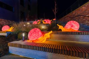 a group of colorful umbrellas sitting on steps at Emily Magic Hostel in Vynnyky +19 photos