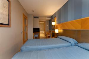 เตียงในห้องที่ Hotel del Mar