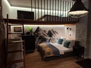 a bedroom with a bunk bed with a mountain mural at Izerski zakątek in Świeradów-Zdrój