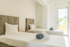 Ένα ή περισσότερα κρεβάτια σε δωμάτιο στο Apartamento Mãe de Deus
