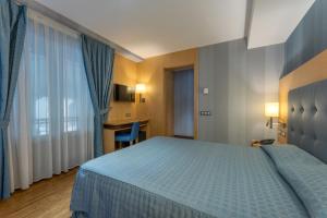 a hotel room with a bed and a desk at Hotel del Mar in Barcelona +37 photos