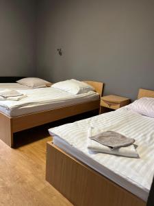 two beds in a room with two beds sidx sidx sidx at Akademia Tenisa Prawobrzeże in Szczecin +11 photos