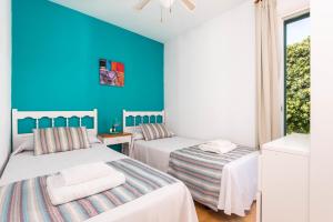 A bed or beds in a room at Bungalows ses malves