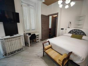 Postel nebo postele na pokoji v ubytování Aparthotel Dei Mercanti