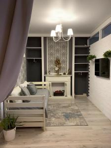 a bedroom with a bed and a fireplace at Центр Либідь Плаза Новобудова провулок Лапушкіна 9 in Khmelnytskyi