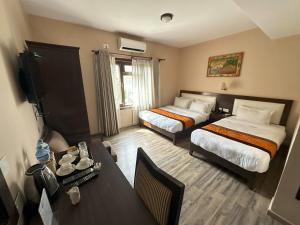 Voodi või voodid majutusasutuse Hotel Shuman, Boudha toas
