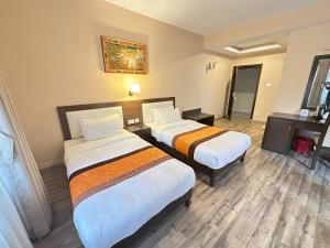 Voodi või voodid majutusasutuse Hotel Shuman, Boudha toas