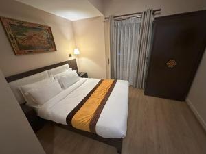 Voodi või voodid majutusasutuse Hotel Shuman, Boudha toas