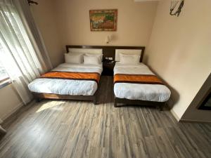 Voodi või voodid majutusasutuse Hotel Shuman, Boudha toas