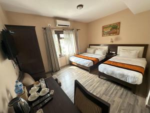 Voodi või voodid majutusasutuse Hotel Shuman, Boudha toas