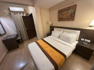 Voodi või voodid majutusasutuse Hotel Shuman, Boudha toas