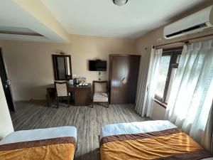 Voodi või voodid majutusasutuse Hotel Shuman, Boudha toas