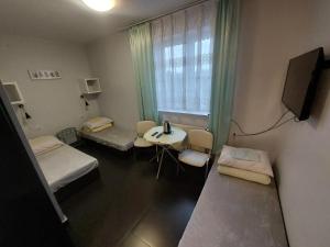 a hospital room with two beds and a window at Pokoje Hotelowe Noclegi Hotel Pensjonat Venus Siedlce in Siedlce