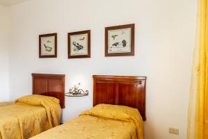 Postel nebo postele na pokoji v ubytování Agriturismo Bio Fattoria Casetta