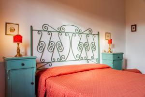 Postel nebo postele na pokoji v ubytování Agriturismo Bio Fattoria Casetta