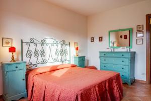 Postel nebo postele na pokoji v ubytování Agriturismo Bio Fattoria Casetta