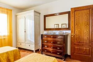 Postel nebo postele na pokoji v ubytování Agriturismo Bio Fattoria Casetta