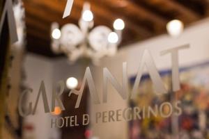 a sign in a store with the words oakland hotel preparing at Gar Anat Hotel Boutique in Granada