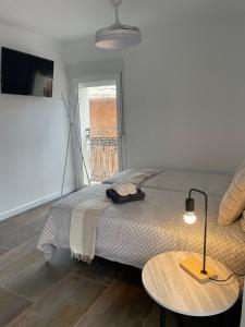 Postel nebo postele na pokoji v ubytování Jorge Juan Apartamento
