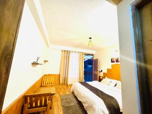 Voodi või voodid majutusasutuse Bayith Cafe and Stay toas