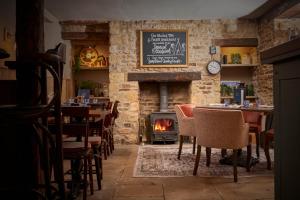 A seating area at The Trout at Tadpole Bridge