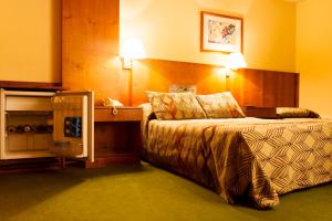 Postel nebo postele na pokoji v ubytování Hotel del Jardín