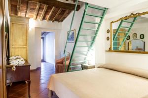 Postel nebo postele na pokoji v ubytování Agriturismo Bio Fattoria Casetta